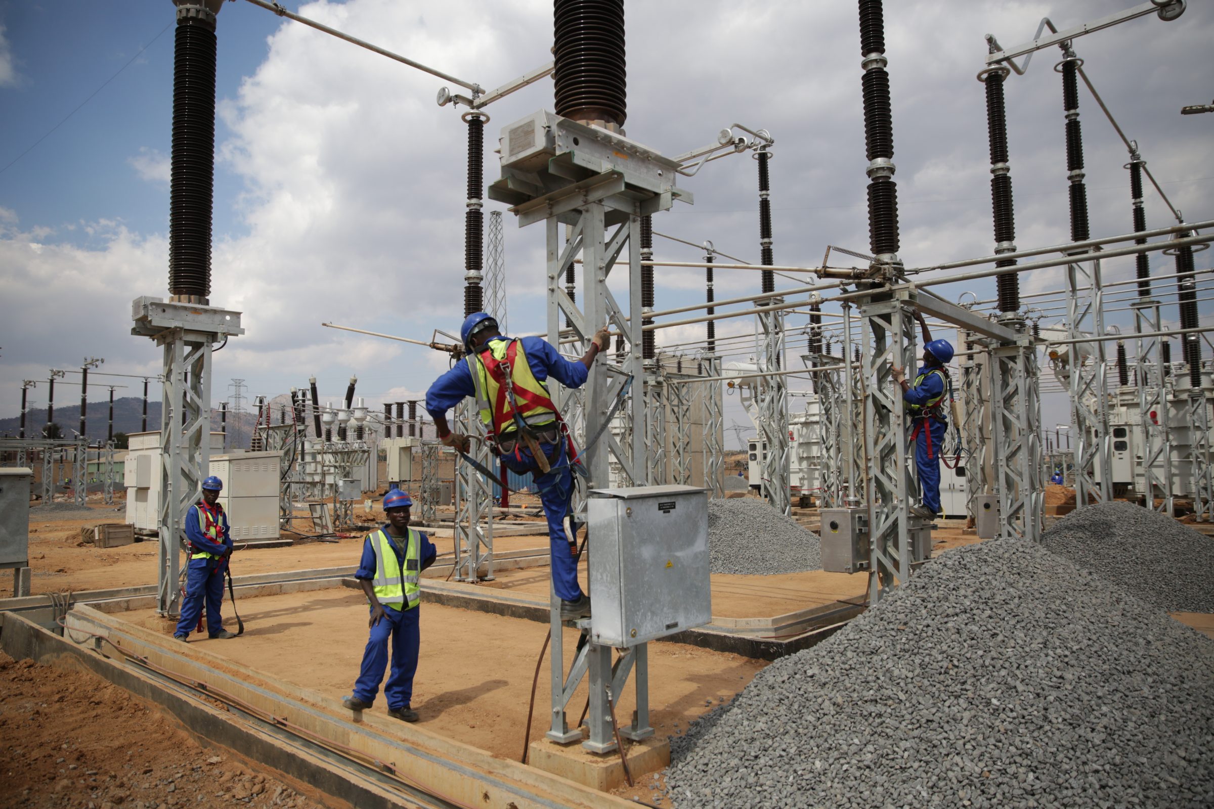 Photograph of utility workers upgrading transmission infrastructure