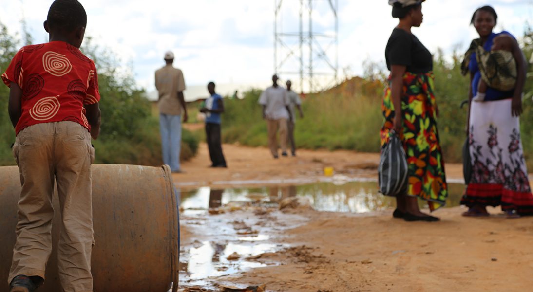 A boy rolls a barrel toward a water source in Lusaka. In partnership with MCC, the Zambian Government is working to reform the country’s water sector and improve drainage in the capital city of Lusaka to better meet citizens’ water and sanitation needs.
