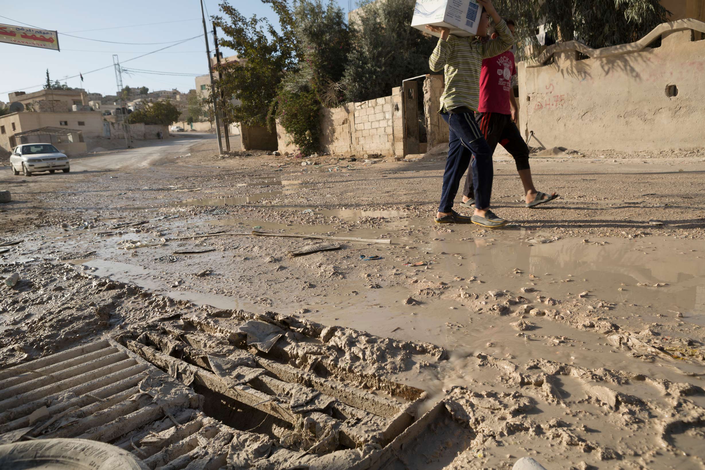 Raw wastewater overflows from sewers into the streets and neighborhoods of the city of Zarqua, Jordan in 2013.