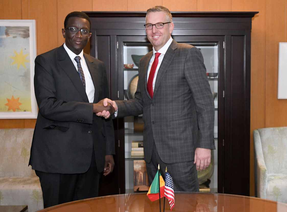 MCC COO and Head of Agency Jonathan Nash and Senegalese Minister of Economy, Finance and Planning Amadou Ba shake hands during the ceremony to mark the signing of the MCC Senegal Power Compact at the State Department.