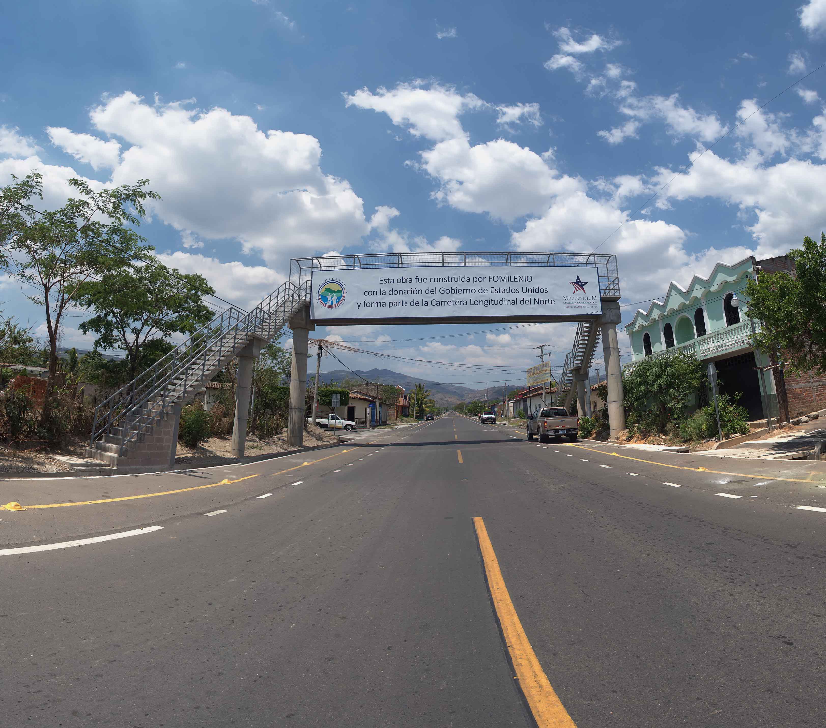 improved section of road with banner of MCC and FOMILENIO logos