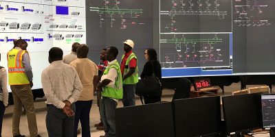 ESCOM staff demonstrate the compact supported supervisory control and data acquisition (SCADA) system for monitoring and controlling the transmission grid in Blantyre, Malawi.