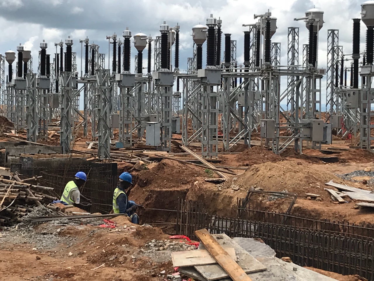Construction workers building substation