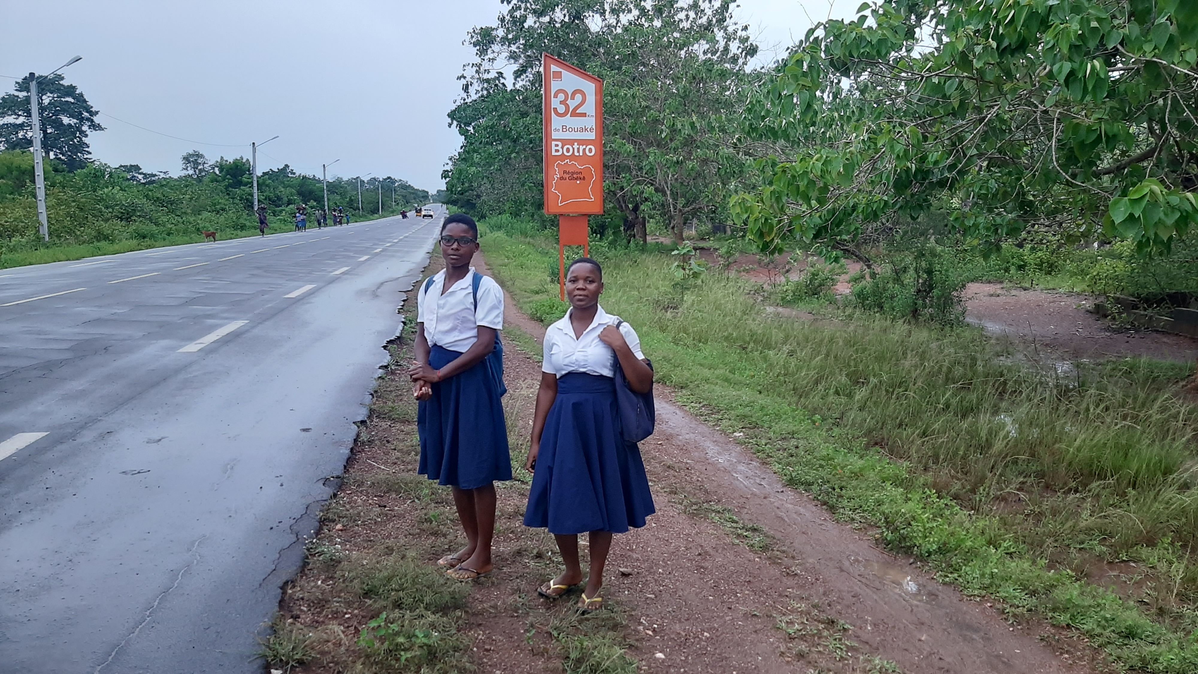 Students in Bouaké wait for a ride to school