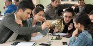 Georgian students using science lab equipment