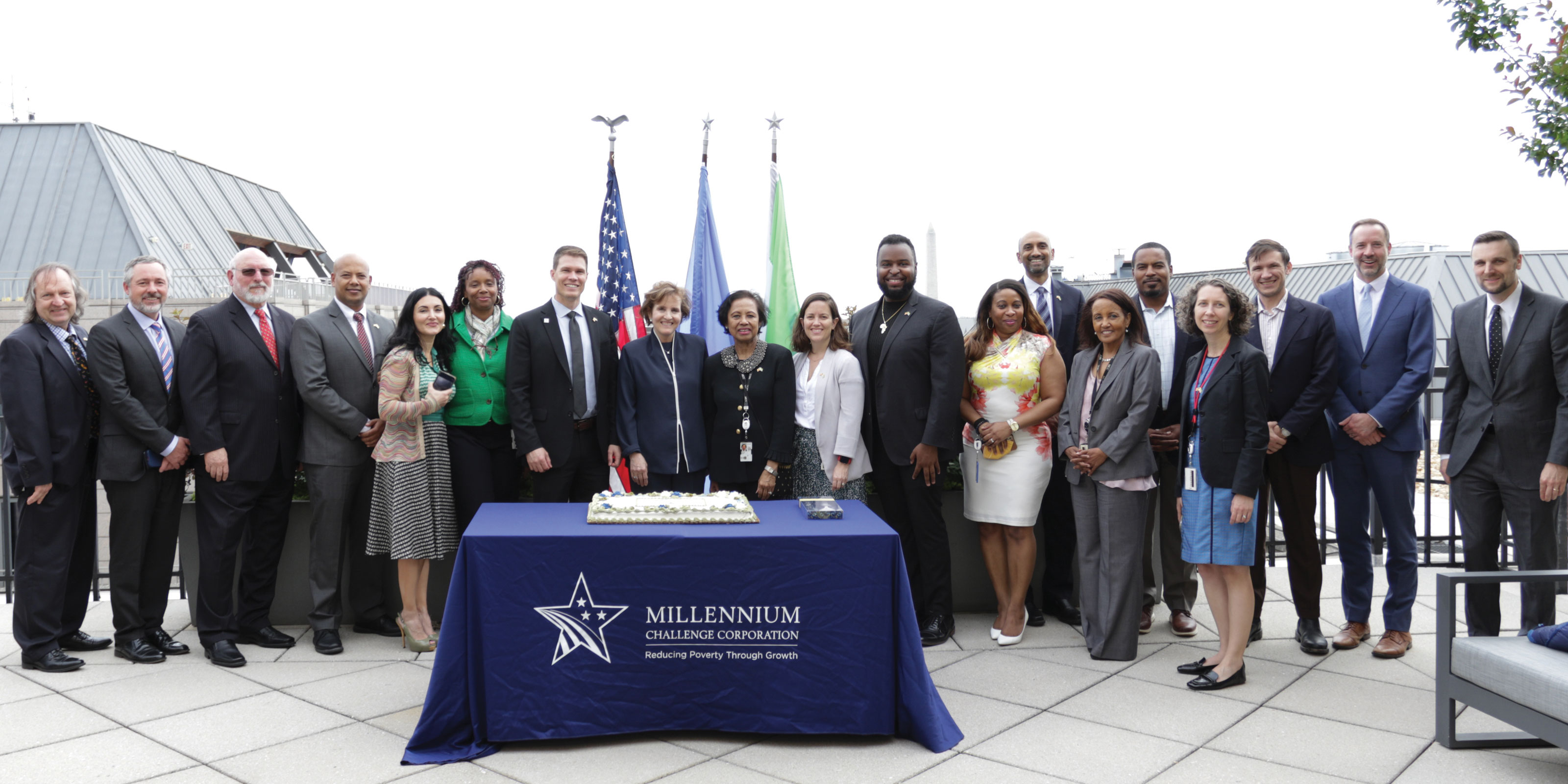 MCC staff and CEO Alice Albright photographed on MCC's office rooftop.