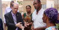 MCC Vice President for Compact Operations Robert Blau talks with Crisolita, a beneficiary of MCC’s investments in water and sanitation in Cabo Verde. Crisolita now has a toilet and water in her home on the island of São Vicente.