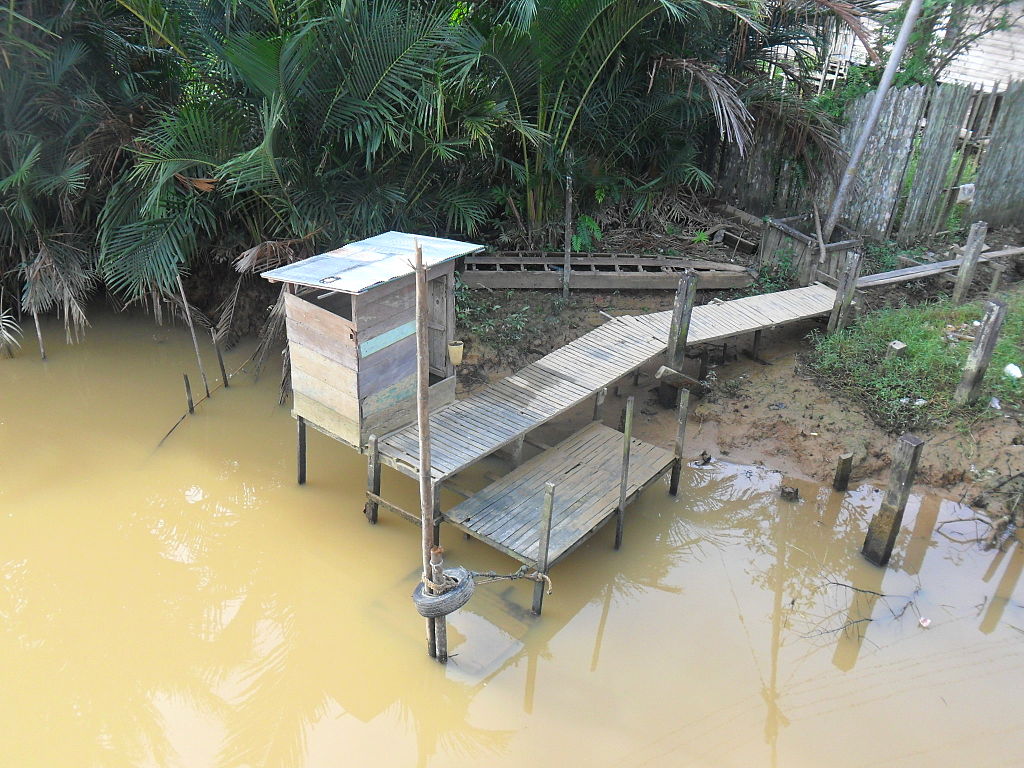 Latrines on the edge of the river in Kalimantan, Indonesia.