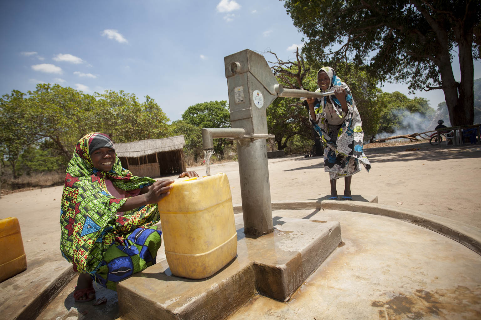 Girls in a village in Mozambique pump fresh water thanks to a hand-powered water pump funded through MCC’s Compact.