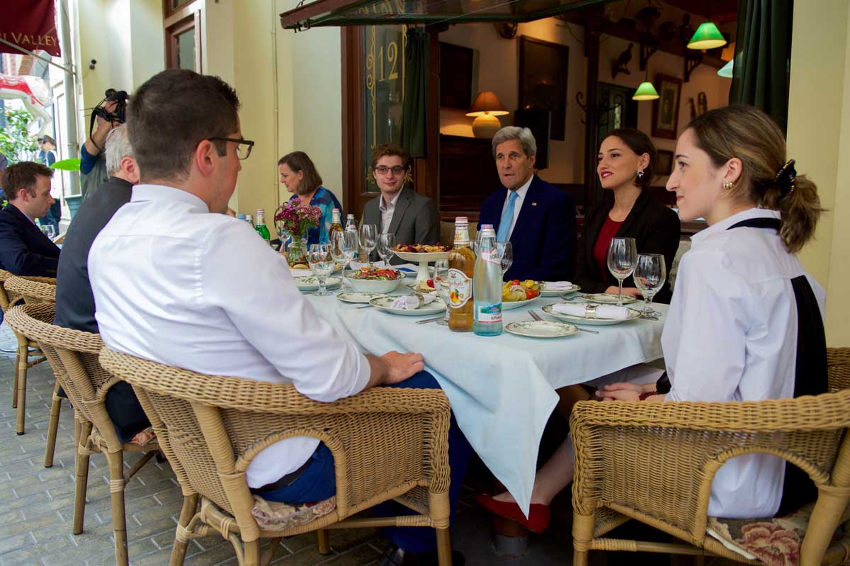 Photo: Secretary of State John Kerry (center) talks with young Georgian entrepreneurs over a meal. San Diego State University-Georgia biochemistry student and beneficiary of MCC’s Georgia Compact Kesi Katsadze (head of the table) had the opportunity to join him during his July 2016 visit to Tbilisi. 